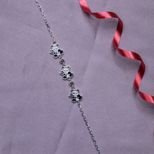A sterling silver bracelet featuring a series of panda charms in silver, white, and black colors, with a rhodium-based anti-tarnish coating.