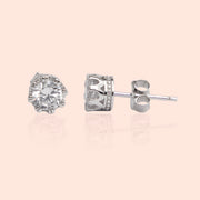 A pair of silver stud earrings featuring a single sparkling white stone each, set in high-quality sterling silver with a rhodium-based anti-tarnish coating.