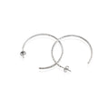 A pair of sterling silver textured hoop earrings with a rhodium-based anti-tarnish coating.
