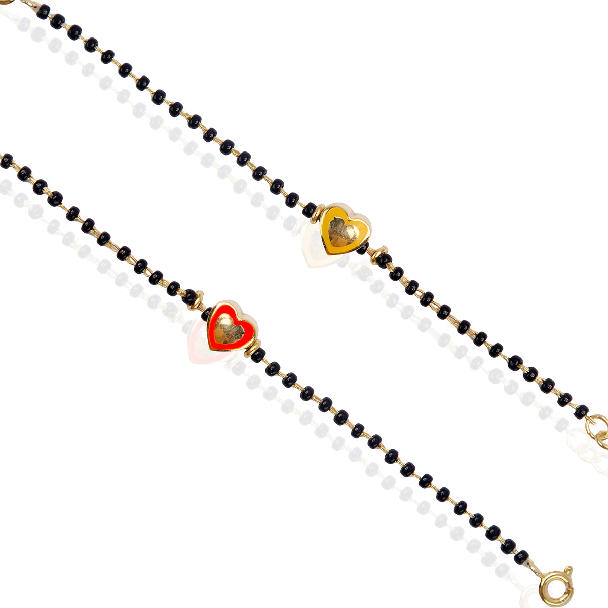 A kids silver bracelet with a golden heart charm and black bead details.
