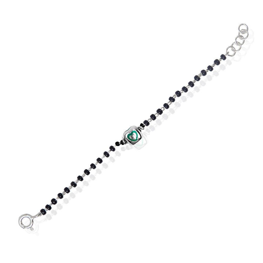 A sterling silver bracelet for kids featuring a green heart charm and black and white beads. Perfect for gifting