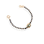 A sterling silver bracelet with rose gold and black accents, featuring a heart-shaped charm and bead details.