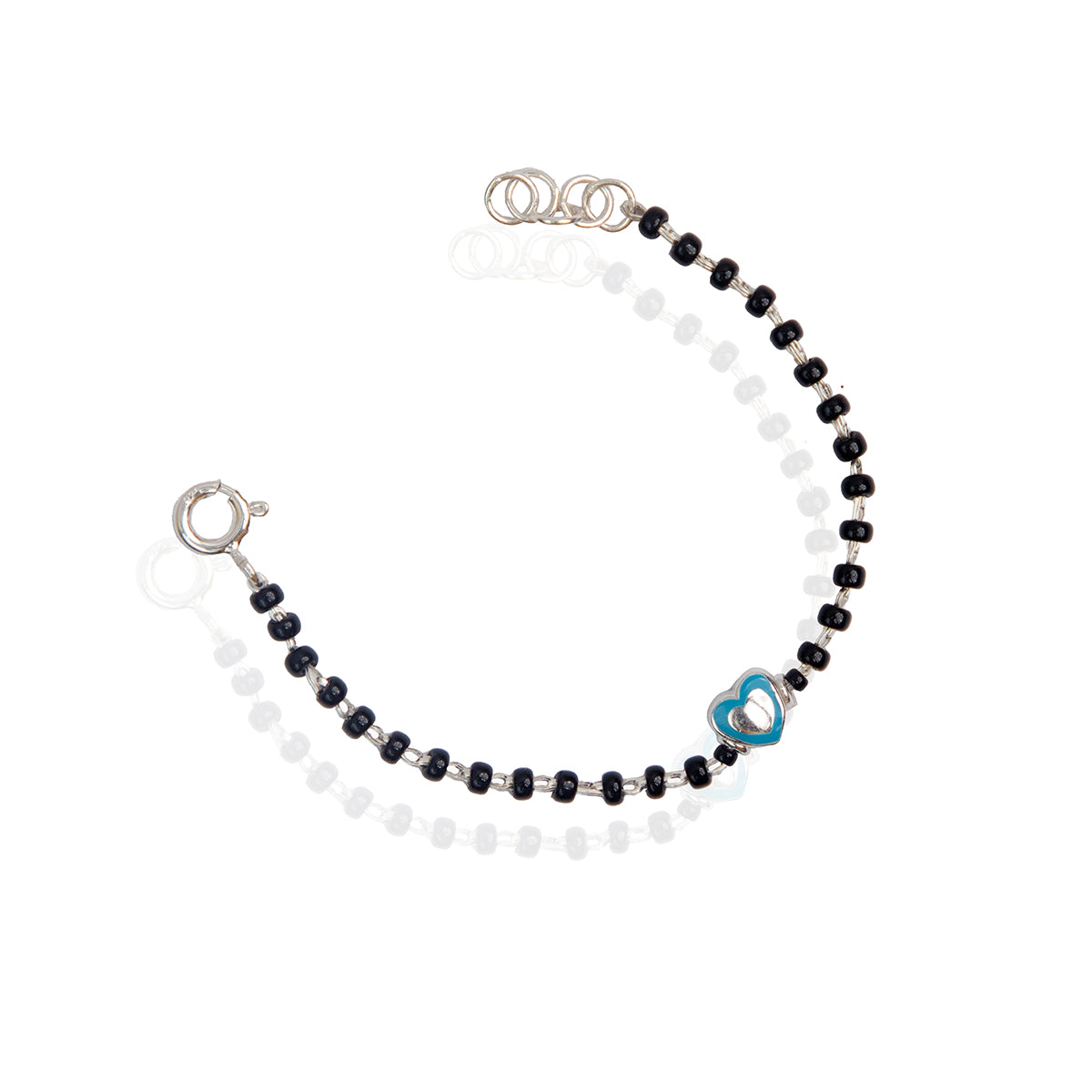 A sterling silver bracelet for kids featuring a green heart charm and black and white bead details.